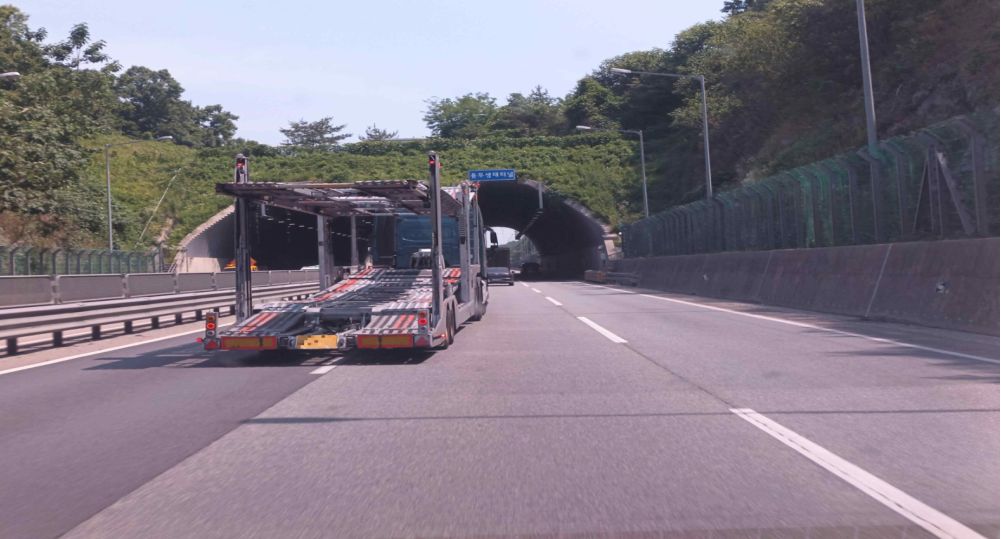 Motorway · A truck in lane 1 that was moving slowly is changing to lane 2 · Traveling in lane 2