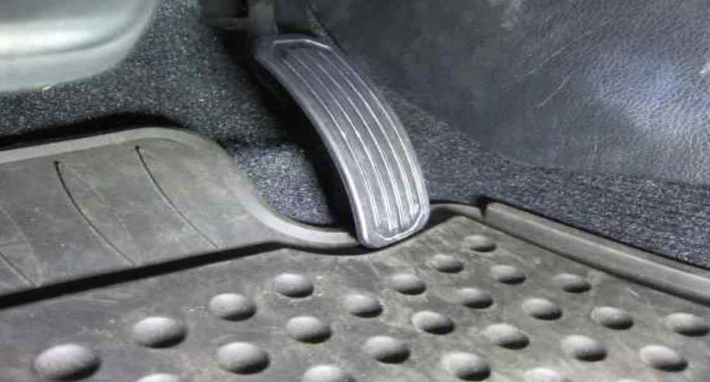 If the accelerator pedal gets caught in the driver's floor mat and does not return, so the car keeps accelerating, which TWO methods let the driver safely stop or slow down?