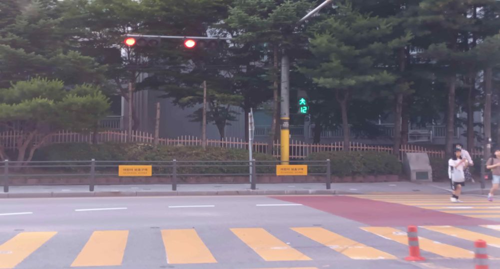 Child protection zone · Three-color vehicle signal ahead showing red · Pedestrian signal at the crosswalk on the right · “T”-shaped intersection (three-way junction)