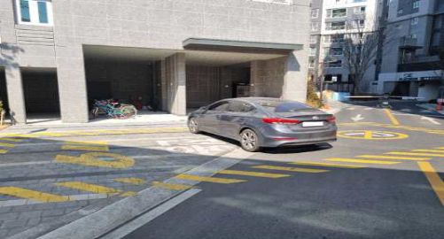 Apartment complex with an entrance barrier
