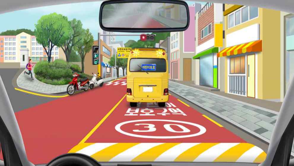 Driving in a children's protection zone · A crosswalk in front of the children's school bus