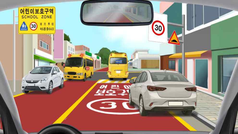 Driving in a children's protection zone · Children's school bus in the opposite direction with flashing red lights on