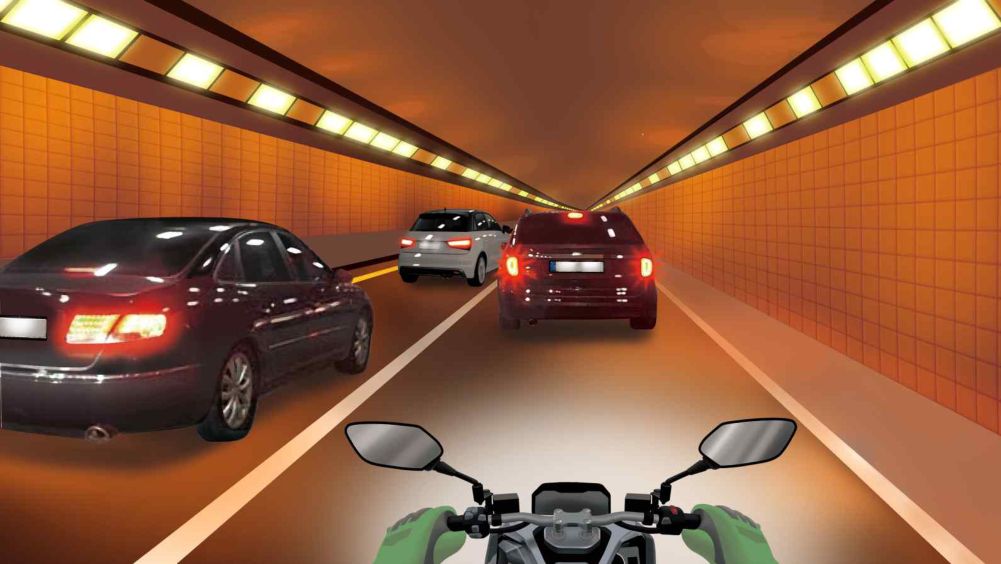 Riding in lane 2 inside a tunnel with two lanes each way · The lane lines are solid white