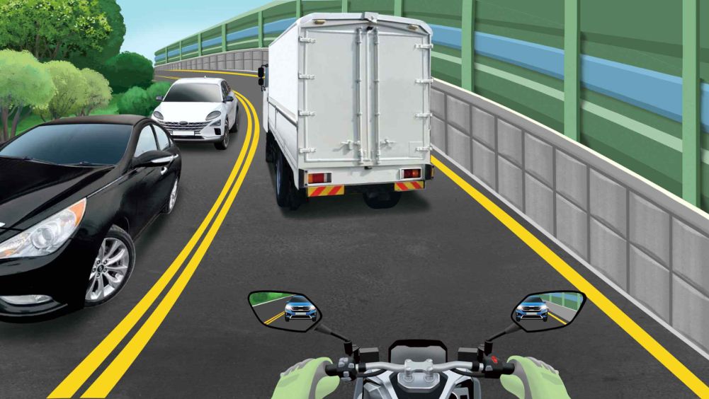 An uphill road with one lane each way · A truck ahead driving slowly · A car following behind