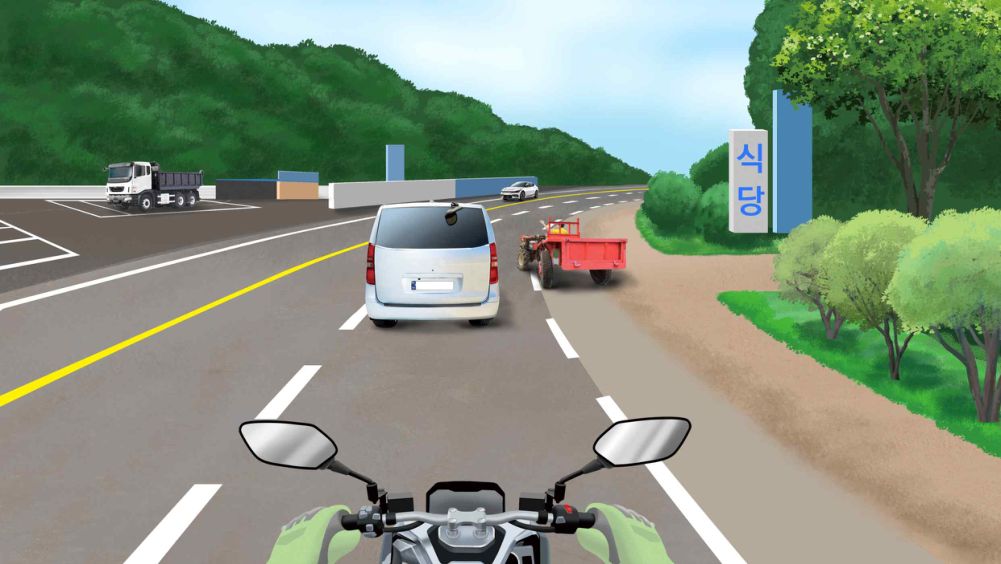 A power tiller is entering the road · A van is slowing down and moving slowly